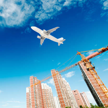 multiple cranes working on huge construction siteの写真素材