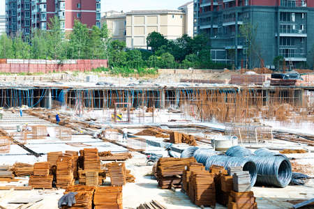 building under construction with workersのeditorial素材