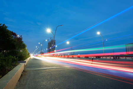 the light trails on the modern building background in shanghai china  の写真素材