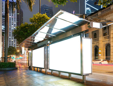 Blank billboard on bus stop at night の写真素材
