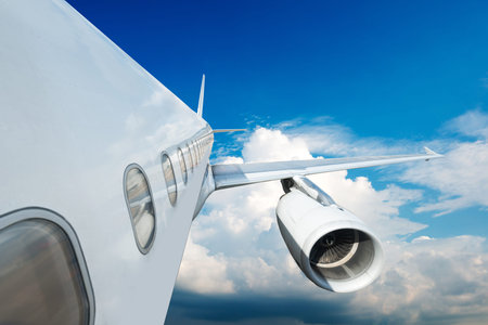 Large passenger plane flying in the blue sky