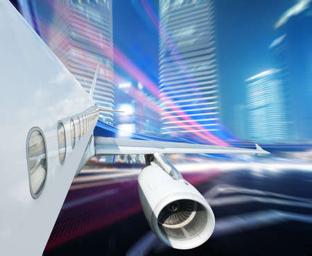 the airplane away from the city,abstract backgroundの写真素材