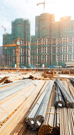 building under construction with workersの写真素材