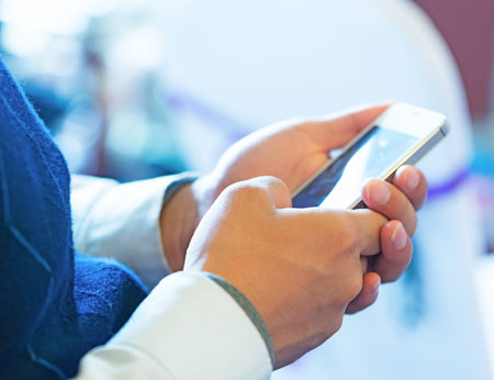 hands are holding and pointing on Smart Phone