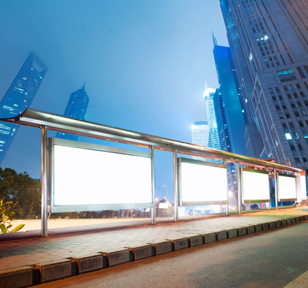 Blank billboard on bus stop at night の写真素材