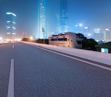 Asphalt road and modern cityの写真素材