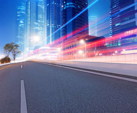 Asphalt road and modern cityの写真素材