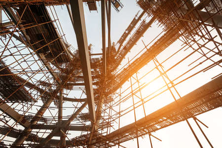 Silhouettes of scaffolding on sunsetの写真素材