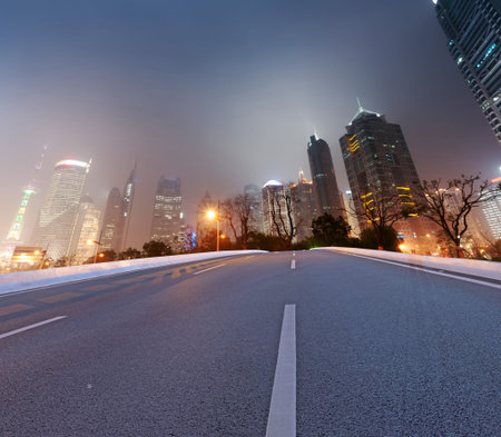 Asphalt road and modern city