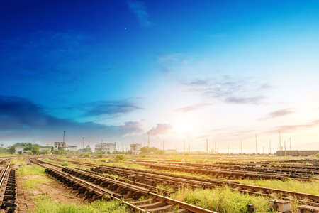 Cargo train platform at sunset with containerの写真素材