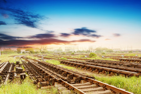 Cargo train platform at sunset with container