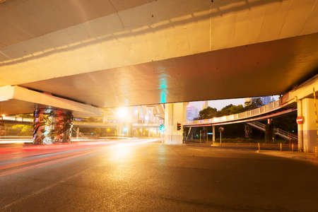 moving car with blur light through city at nightの写真素材