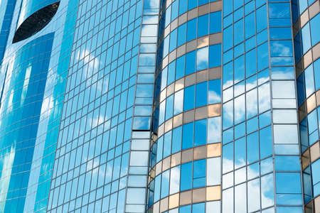 Clouds reflected in windows of modern office buildingのeditorial素材