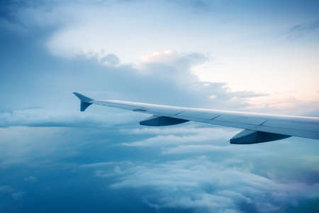 the airplane with the blue sky background.の写真素材