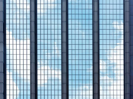 Clouds reflected in windows of modern office buildingのeditorial素材