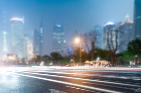 Light trails on the modern building background in Shanghai China.の写真素材