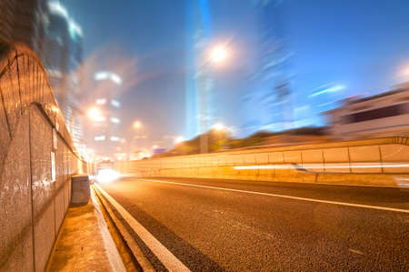 the light trails on the modern building background in shanghai china.の写真素材