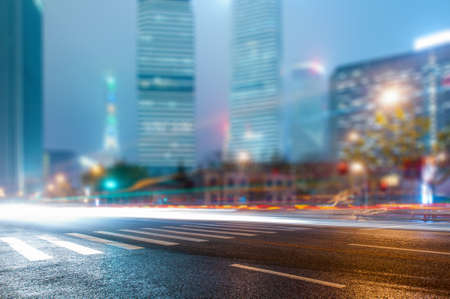 the light trails on the modern building background in shanghai china.の写真素材