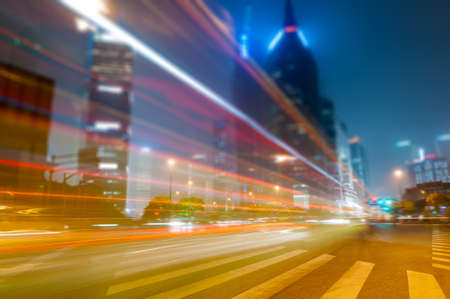 the light trails on the modern building background in shanghai china.の写真素材