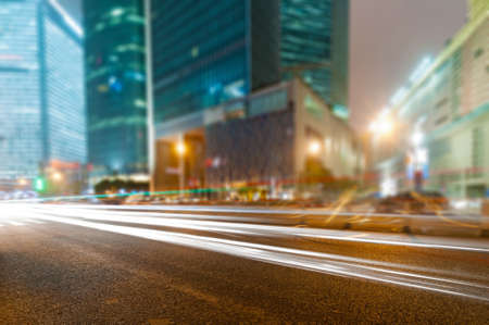 the light trails on the modern building background in shanghai china.の写真素材