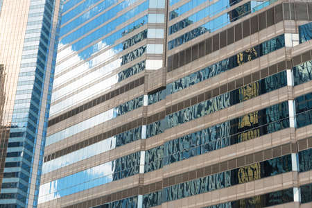 Clouds reflected in windows of modern office buildingのeditorial素材