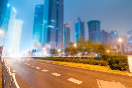 the light trails on the modern building background in shanghai china.の写真素材