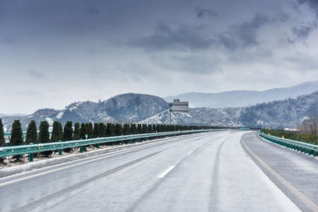 winter on highway curveの写真素材