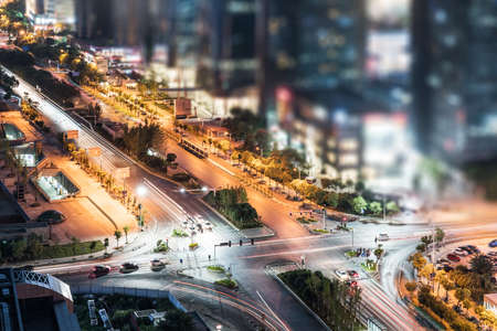 moving car with blur light through city at nightの写真素材