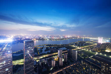 Bird view at Wuhan China. Skyscraper under construction in foreground. Fog, overcast sky and pollution.の写真素材