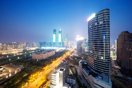 Bird view at Nanchang China. Skyscraper under construction in foreground. Fog, overcast sky and...