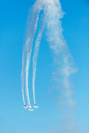 Airplanes on airshow. Aerobatic team performs flight at air showのeditorial素材