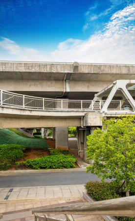 Pedestrian bridge against blue sky
