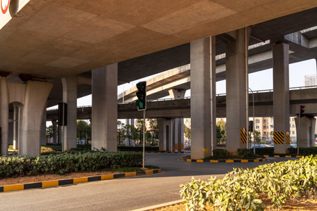 Concrete structure and asphalt road space under the overpass in the city