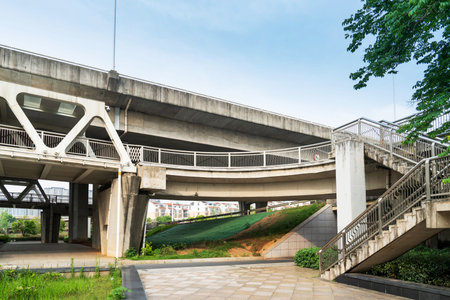Pedestrian bridge against blue sky
