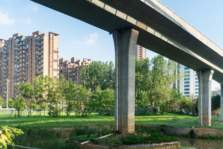 Concrete structure and asphalt road space under the overpass in the cityの写真素材