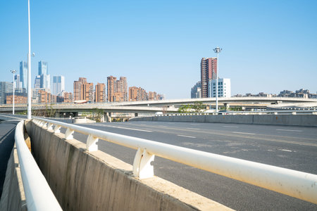 Highway overpass modern city skyline background