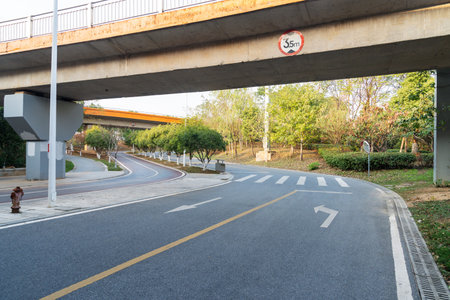 Concrete structure and asphalt road space under the overpass in the city