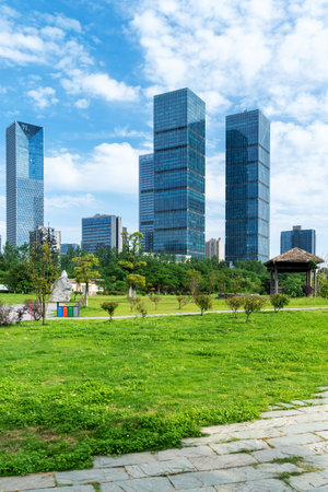 city park with modern building background in shanghaiの写真素材