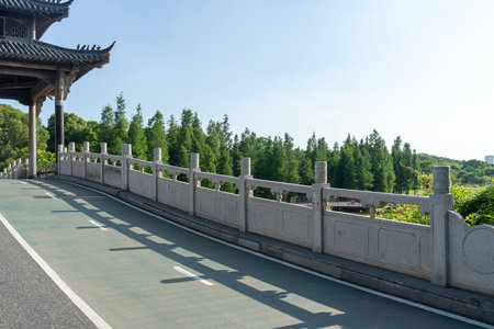 Stone fence beside the park riverの写真素材
