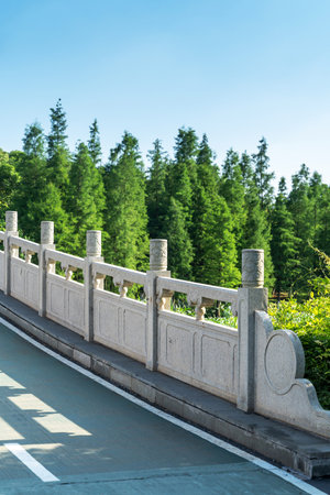 Stone fence beside the park riverの写真素材