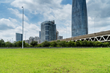 city park with modern building background in shanghaiの写真素材