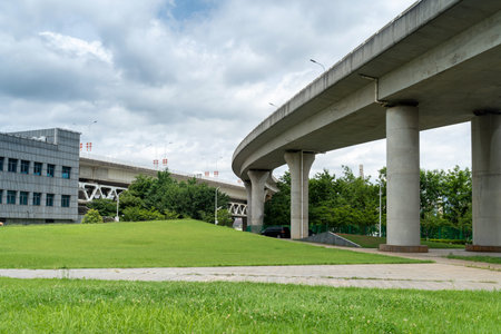 Concrete structure and asphalt road space under the overpass in the city