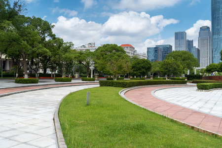 city park with modern building background in shanghaiの写真素材