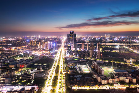 Bird view at Nanchang China. Skyscraper under construction in foreground. Fog, overcast sky and pollution. Bund (Nanchang) areaの写真素材