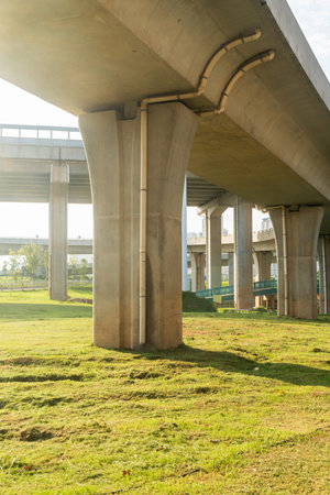 Concrete structure and asphalt road space under the overpass in the city