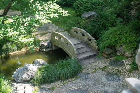 stone footbridge in an Asian gardenの写真素材