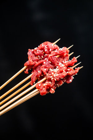 Raw shish kebab on black backgroundの写真素材