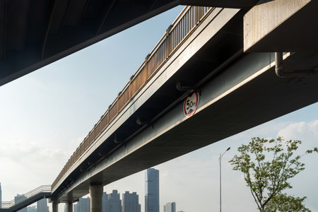 Pedestrian bridge against blue skyの写真素材