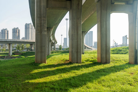 Concrete structure and asphalt road space under the overpass in the city