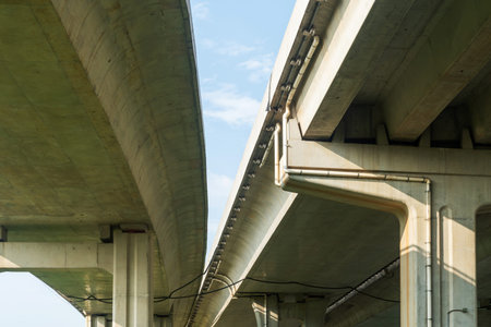 Elevated expressway during a sunny day. highway overpass against blue sky